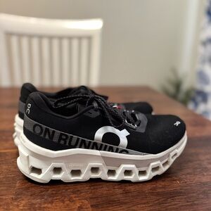 On Cloud Cloudmonster 2 running shoes in black and white. Size 7.